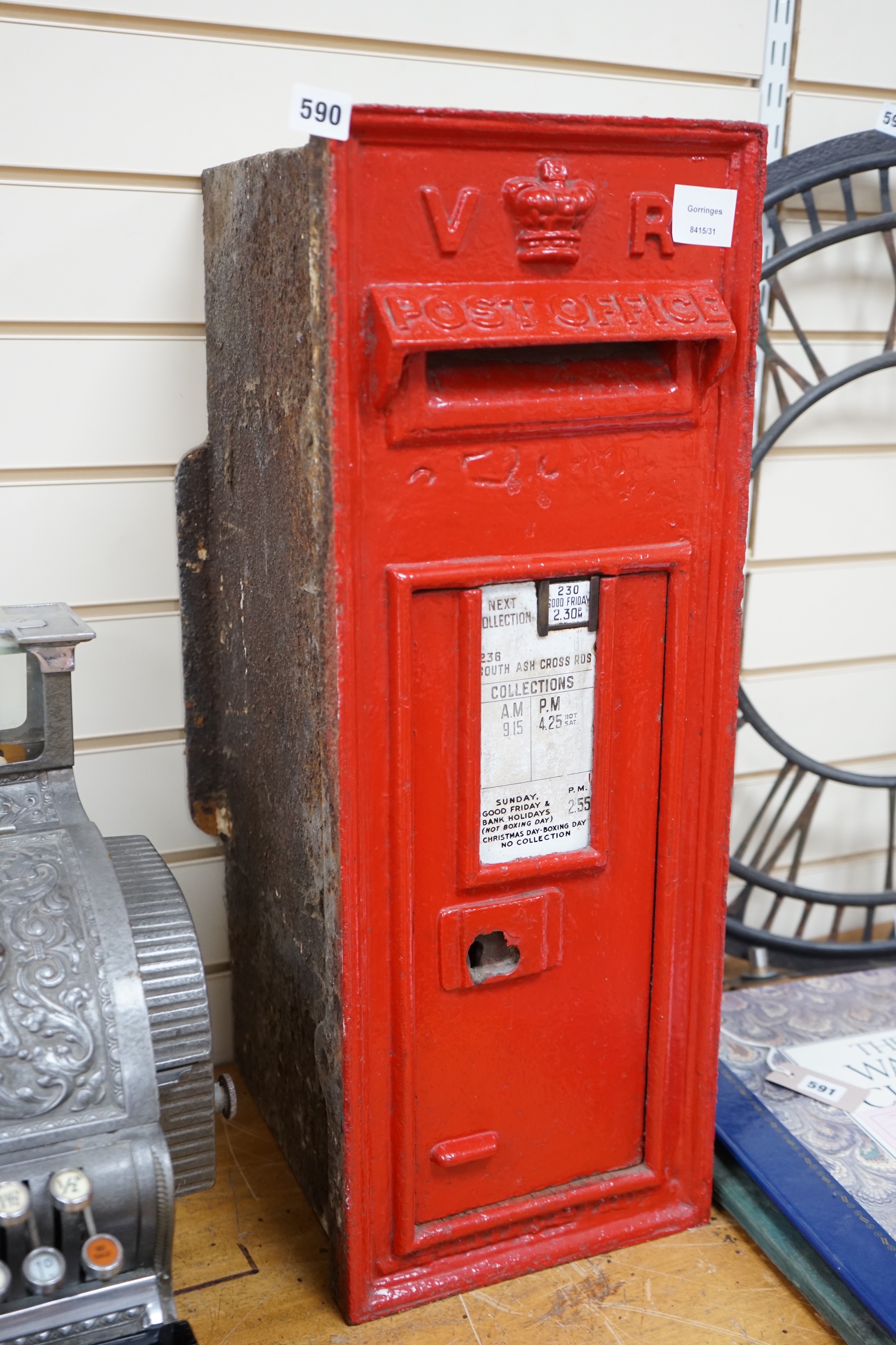 A Victorian red painted cast iron wall mounted post box, 72cm tall